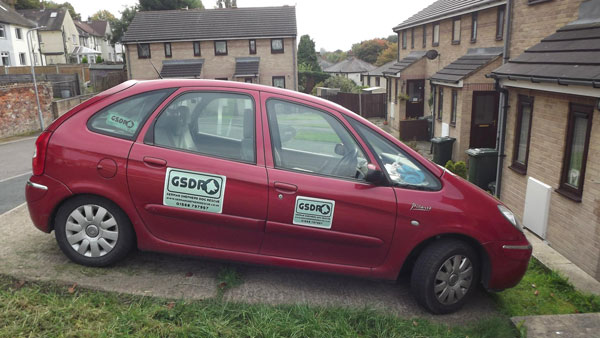 volunteers car covered in gsdr stickers